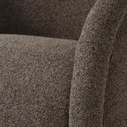 Poltrona girevole moderna in tessuto bouclé con base in legno massello